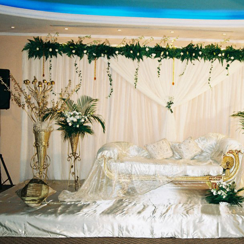 Golden and White with Flower wedding stage decoration UAE