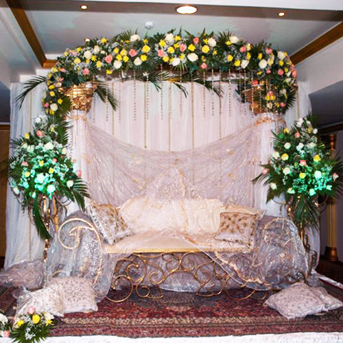 white and golden theme wedding stage decoration by KoshaUAE